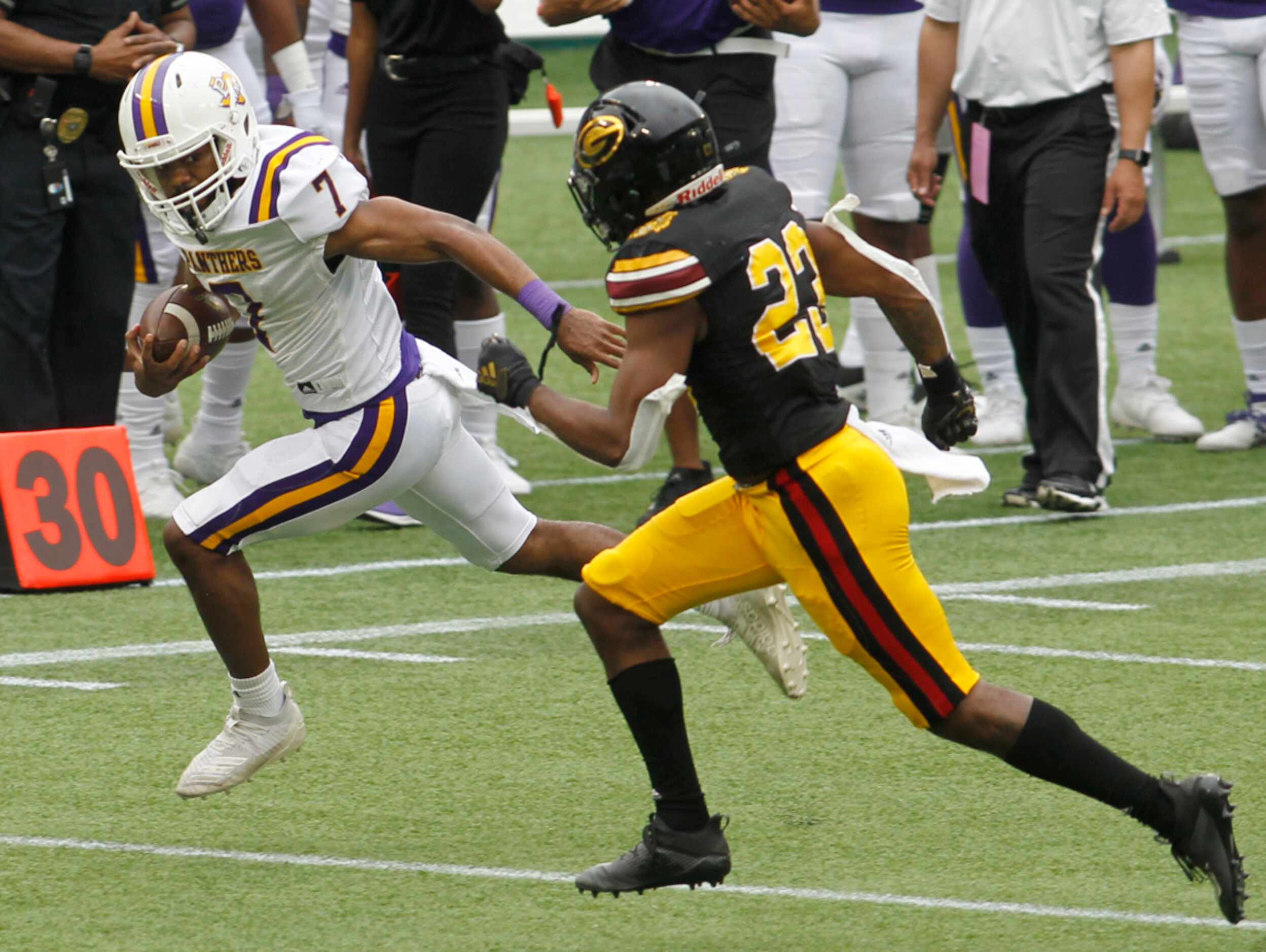 Prairie View A&M running back Kristian Mosely (7) runs away from the pursuit of Grambling...