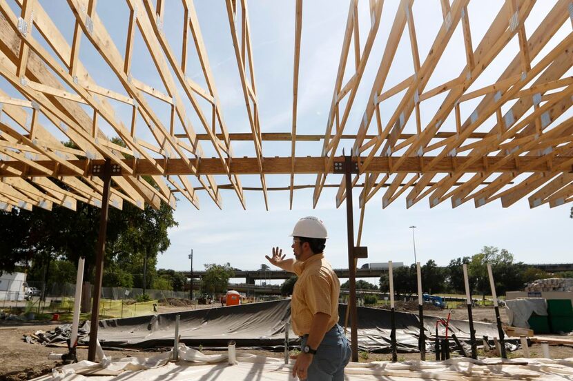 
Keith Ackerman, executive director of The Cottages at Hickory Crossing, leads a...