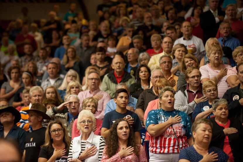 Supporters said the Pledge of Allegiance before a campaign rally this month for Republican...