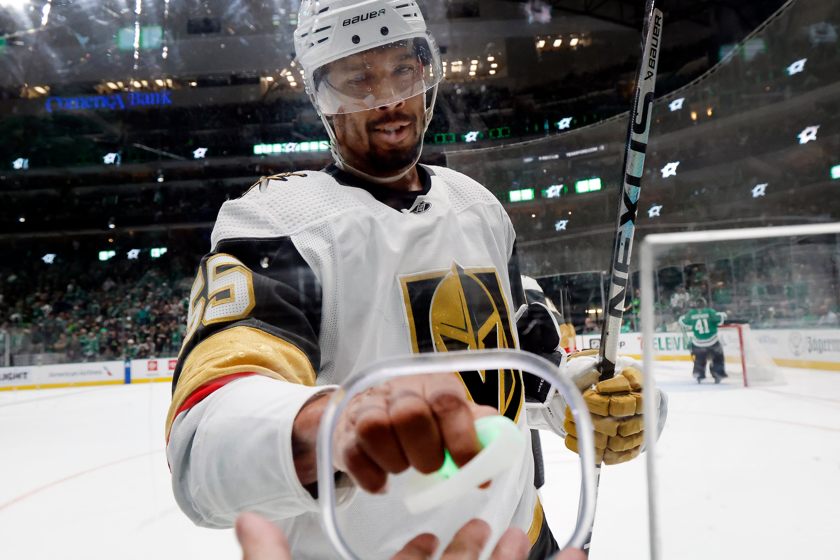 Vegas Golden Knights right wing Keegan Kolesar (55) hands wrist lights, change and watch...