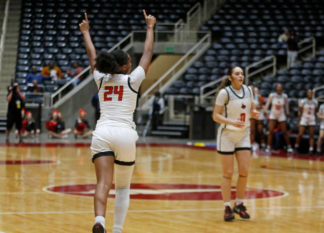 Frisco Liberty High’s G Jacy Abii (24) celebrates after making a shot during the first half...