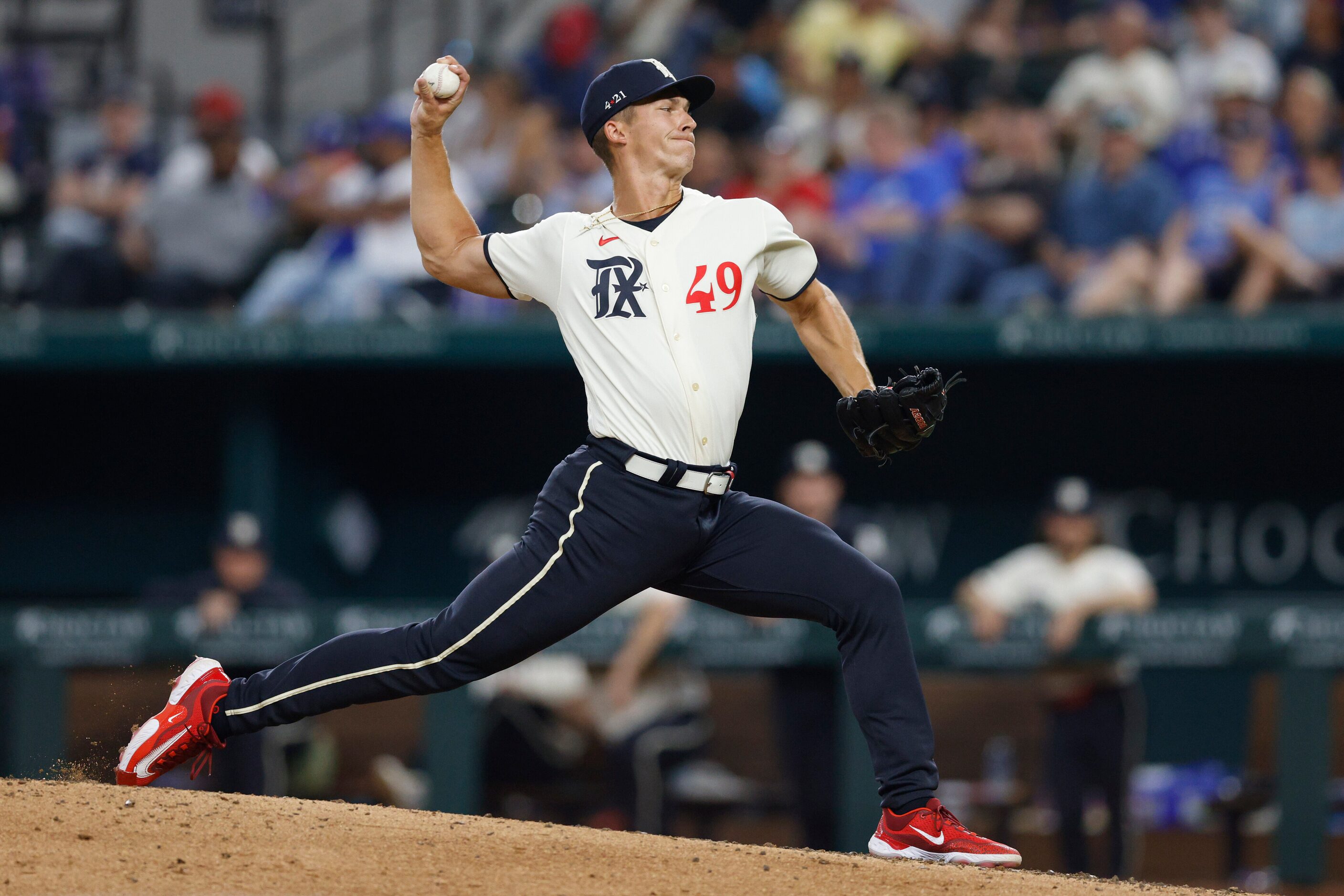 Texas Rangers relief pitcher Glenn Otto delivers a pitch during the ninth inning of a game...