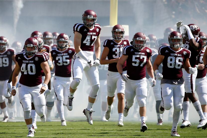 Texas A&M players take the field to play against Tennessee at Kyle Field in College Station,...