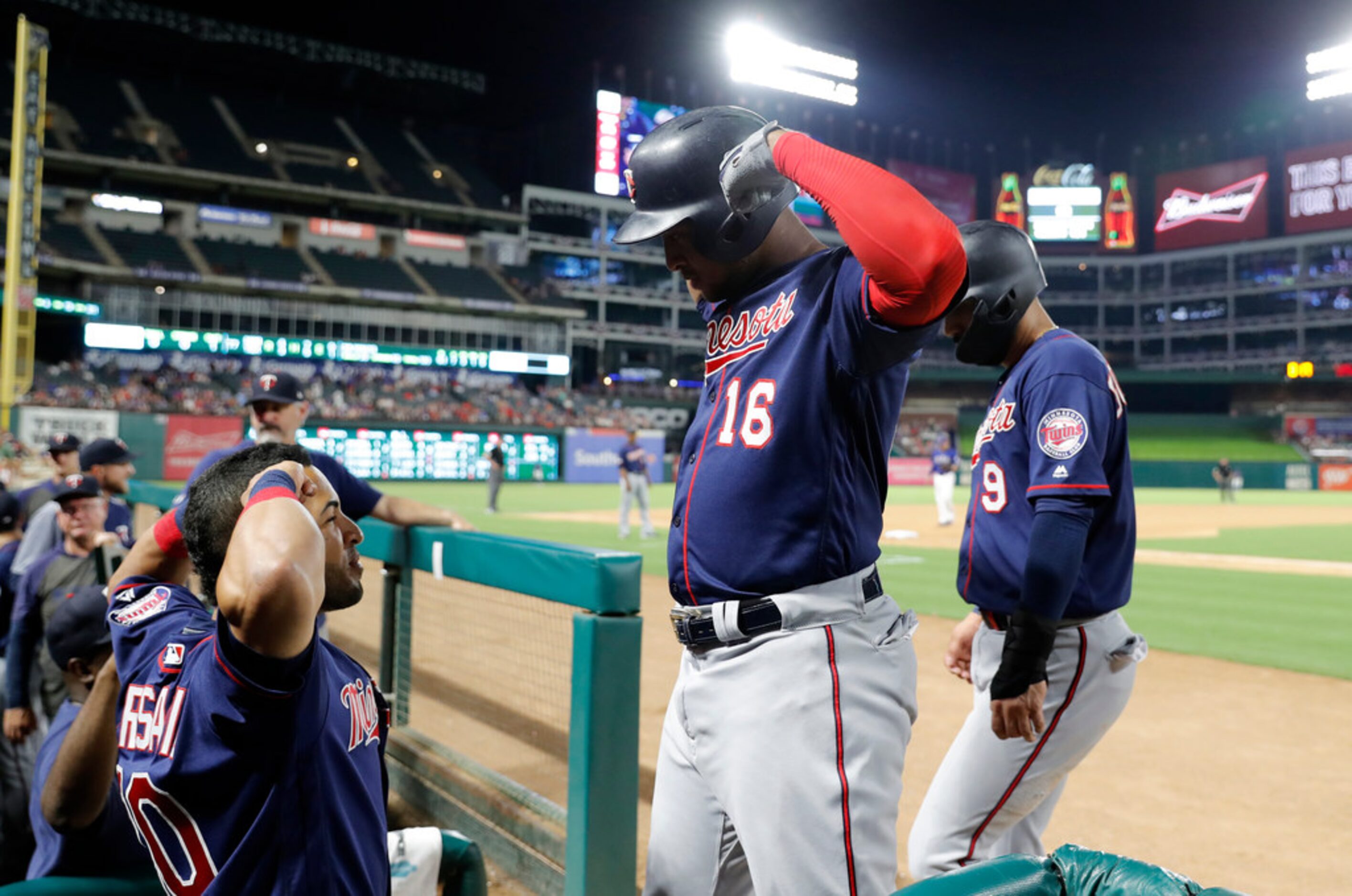 Minnesota Twins' Eddie Rosario, left, and Jonathan Schoop (16) celebrate a two-run home run...