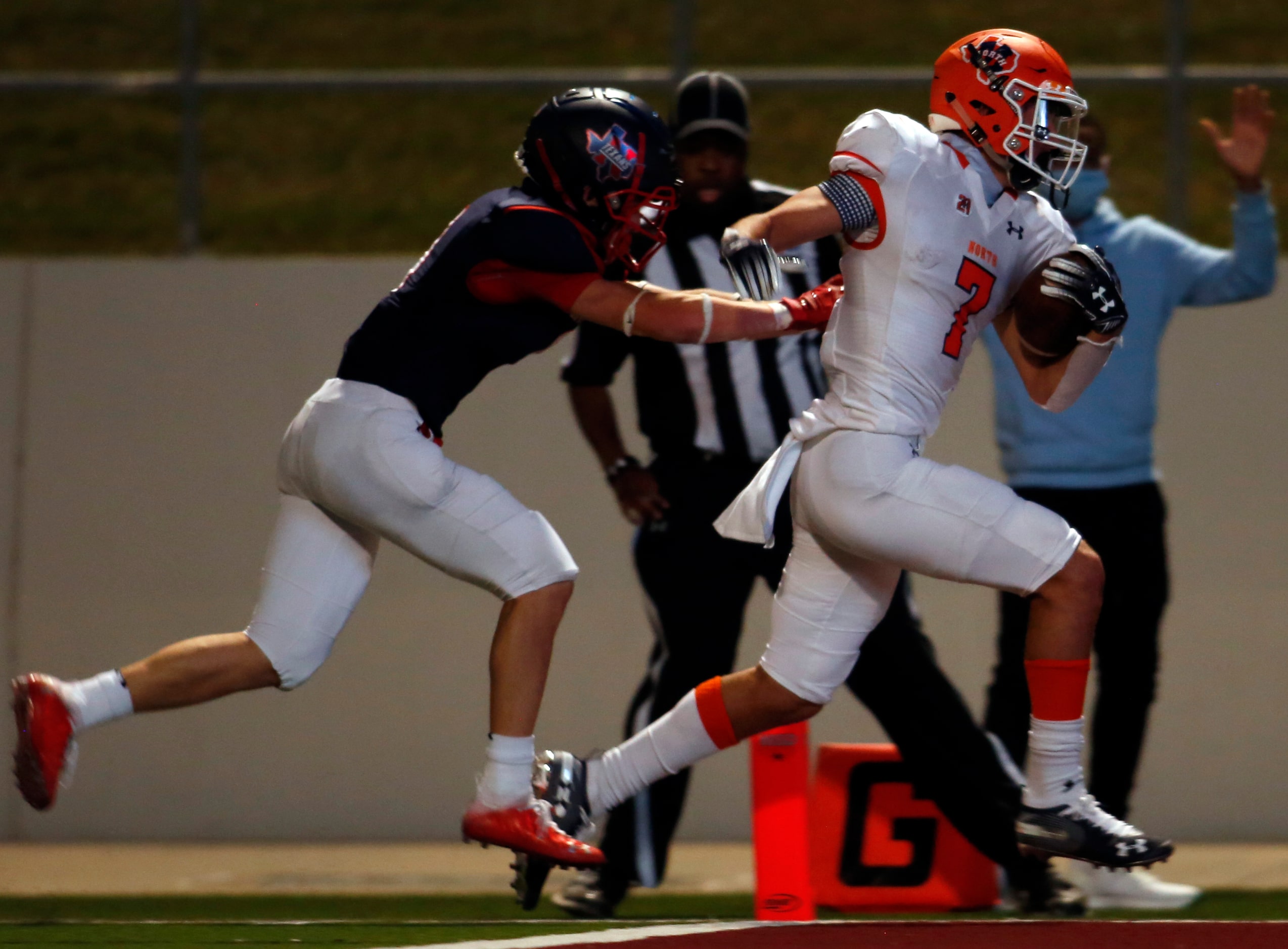 McKinney North receiver Luke Paley (7) outraces Northwest linebacker Jackson Steormann (8)...