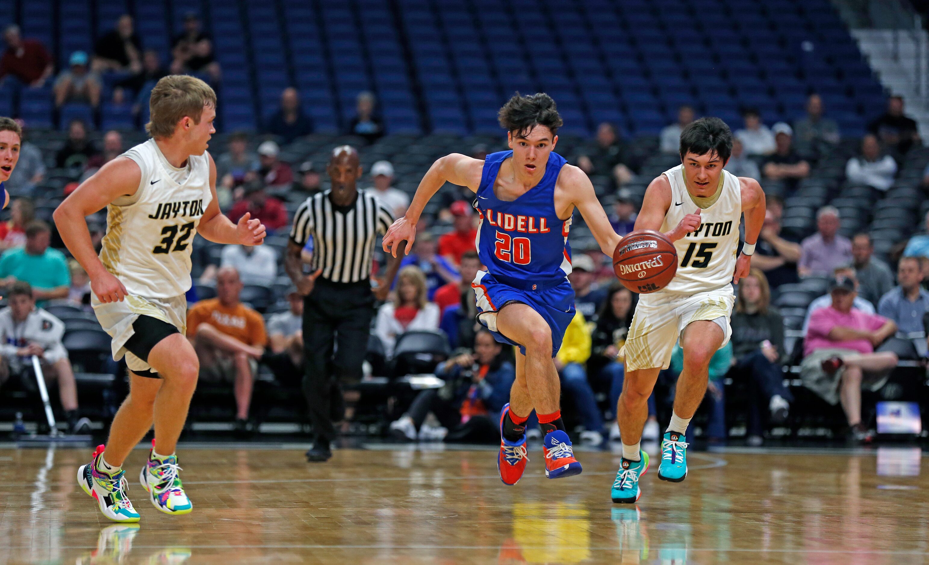 Slidell guard Tristyn Talamantes #20 pushes the ball downcourt after a steal. Slidell...