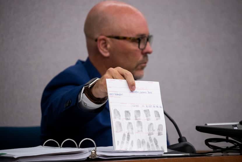 Dallas police homicide detective Scott Sayers shows evidence as he testifies during adult...