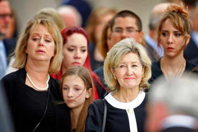 
Former U.S. Sen. Kay Bailey Hutchinson (right) watched as her husband’s casket was loaded...