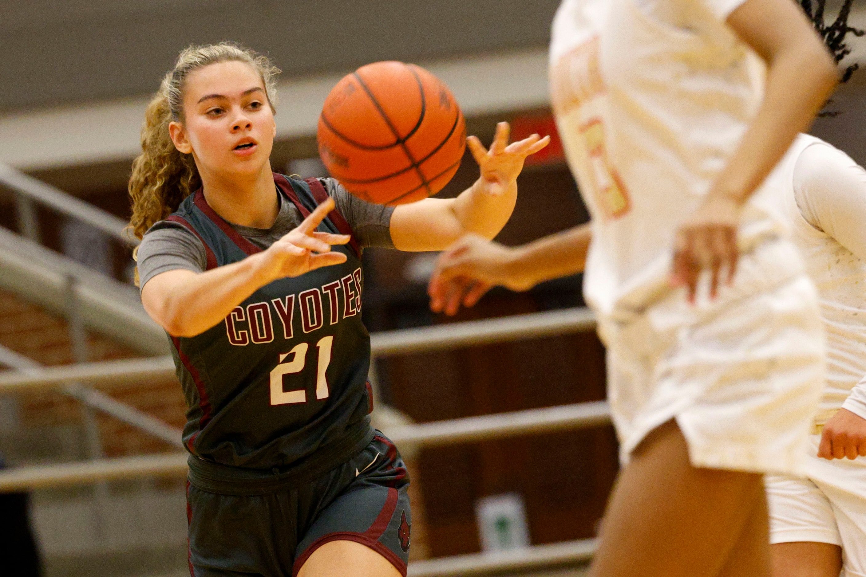 Frisco Heritage's Addy Pate (21) poses the ball during the first half of a high school...