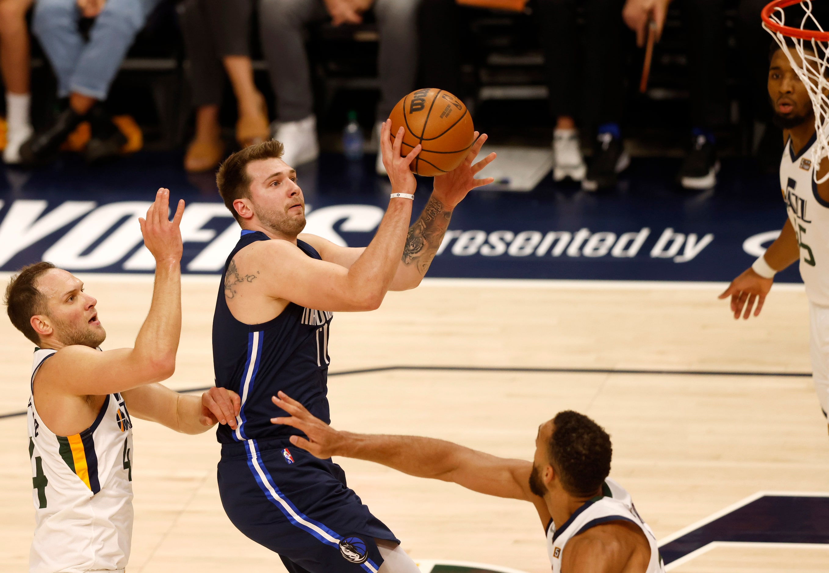 Dallas Mavericks guard Luka Doncic (77) attempts a shot in between Utah Jazz forward Bojan...