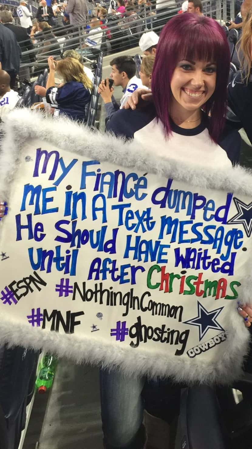 Brenna Clanton and her sign at the Dallas Cowboys game.
