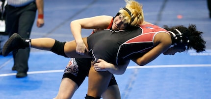 Euless Trinity's Mack Beggs lifts Tascosa's Mya Engert in the 6A girls 110 weight class...