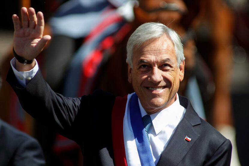 Chilean President Sebastián Piñera waves as he arrives at the metropolitan cathedral in...