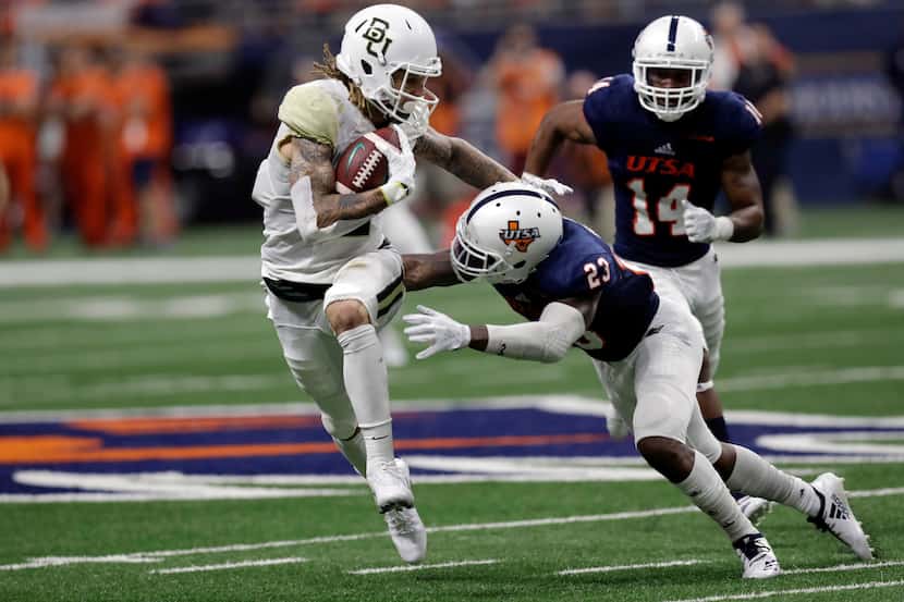 FILE - Baylor wide receiver Jalen Hurd (5) tries to avoid a hit by UTSA safety Darryl...