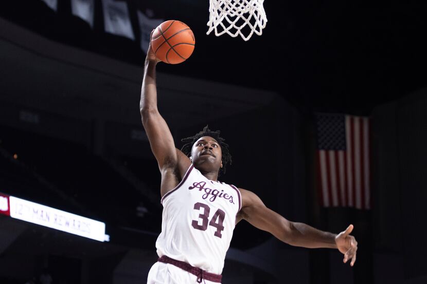 Texas A&M forward Julius Marble (34) goes for a dunk during the second half of an NCAA...