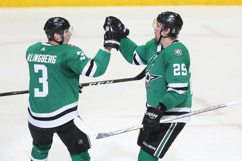 Dallas Stars defenseman John Klingberg (3) and right wing Brett Ritchie (25) celebrate a...