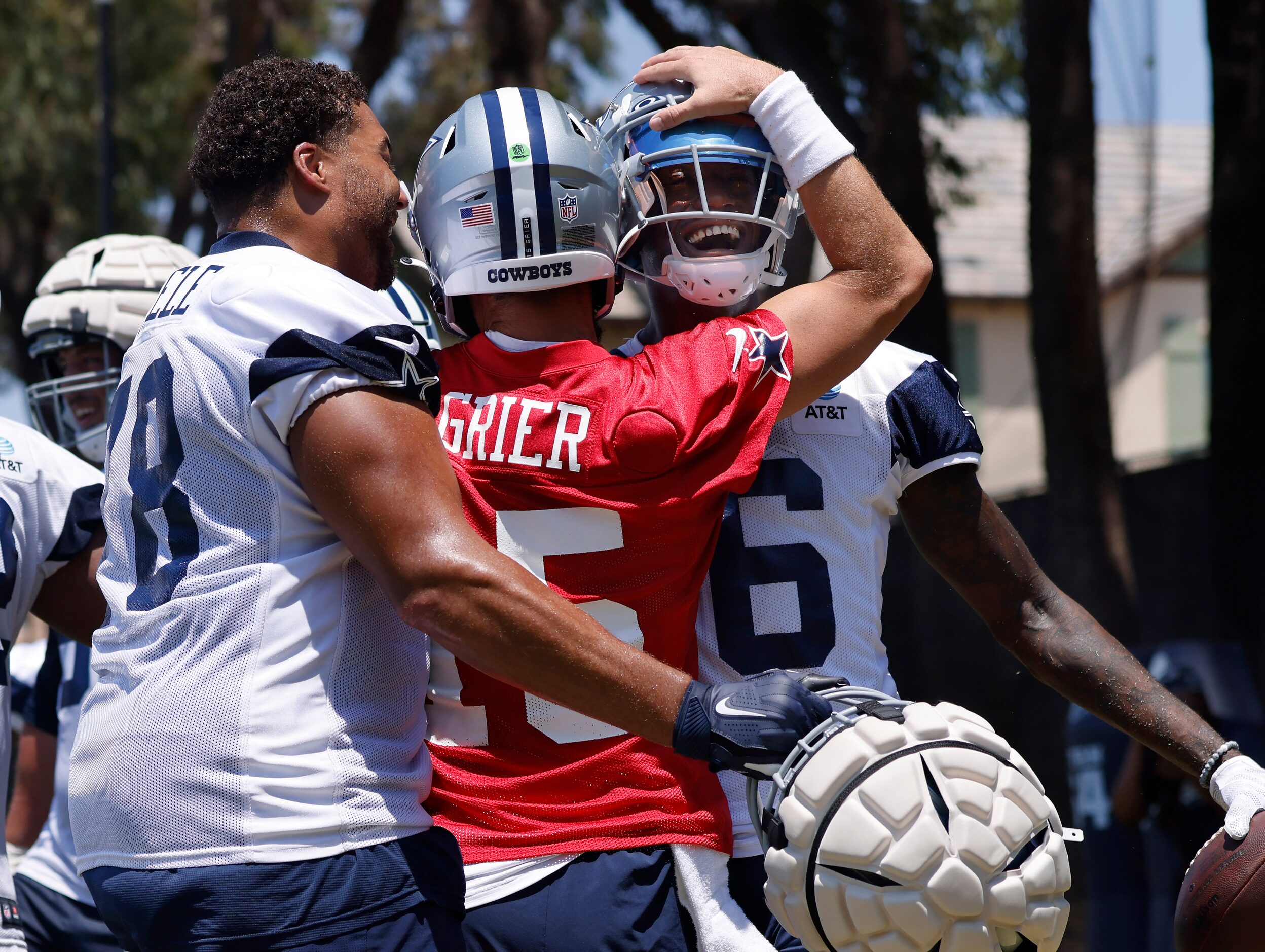 Dallas Cowboys wide receiver T.J. Vasher (16) is congratulated by quarterback Will Grier...