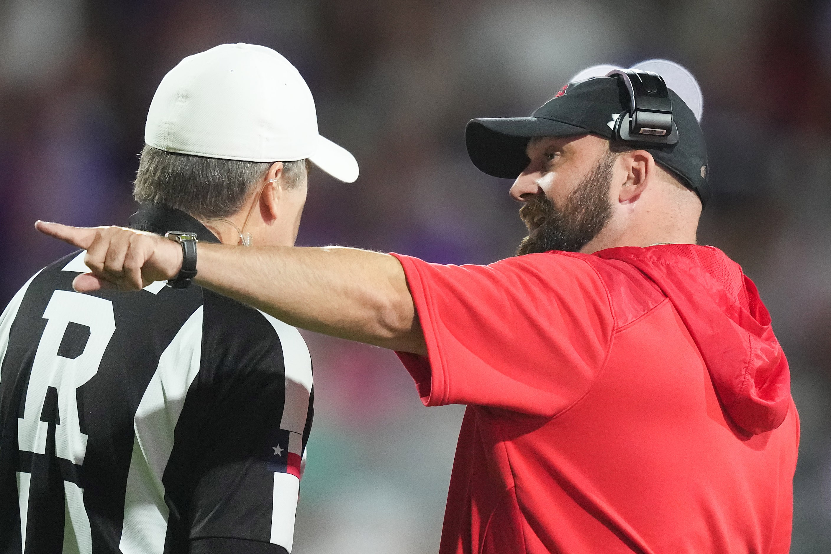 Melissa head coach Matt Nally talks with an official during the first half of a District...