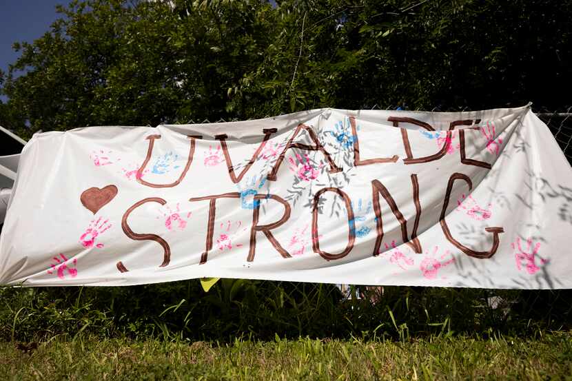 Uvalde Strong written on a tarp at a home to honor the memory of the 19 children and two...