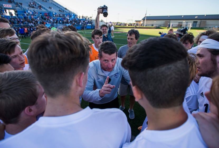 Flower Mound head coach David Doyle talks to his team after a 3-2 win in a UIL conference 6A...