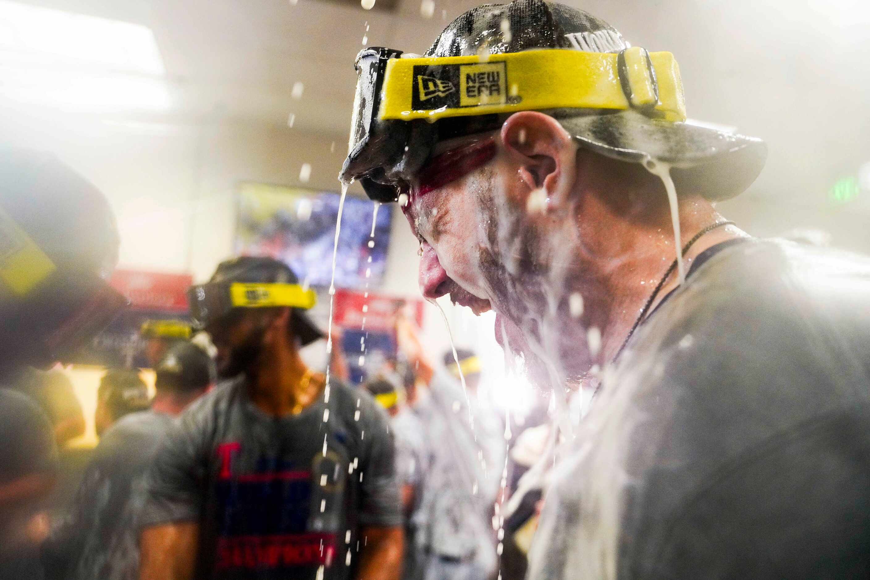 Texas Rangers catcher Jonah Heim celebrates in the clubhouse after defeating the Arizona...