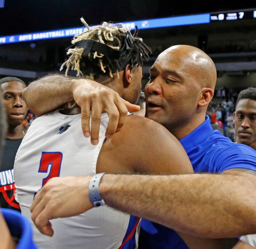 Head coach David Peavy hugs Oak Cliff Faith Academy's Rakeim Gary #3. UIL boys basketball 4A...