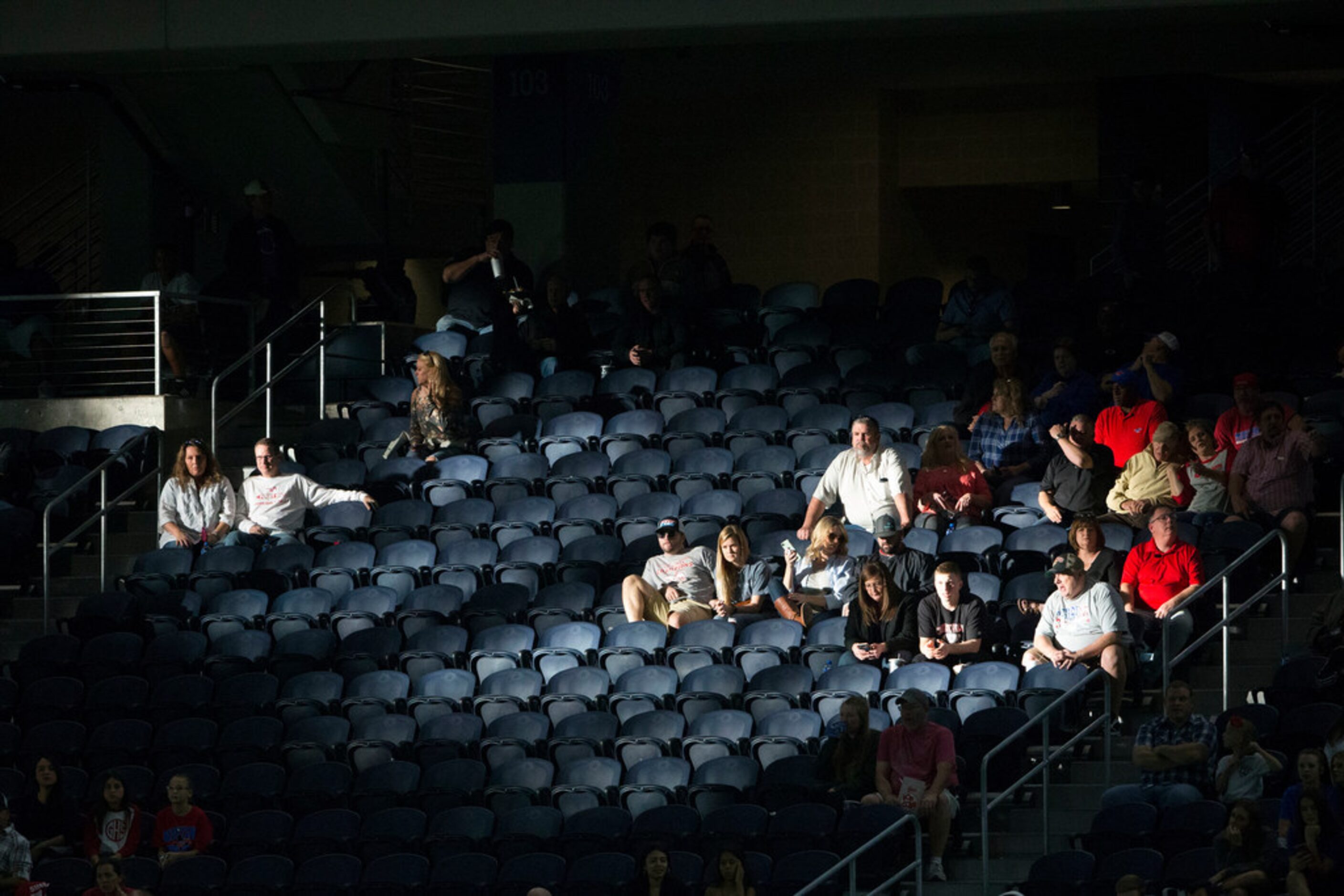 Fans sitting on Grapevine's side of the field are lit by the setting sun as the wait for a...