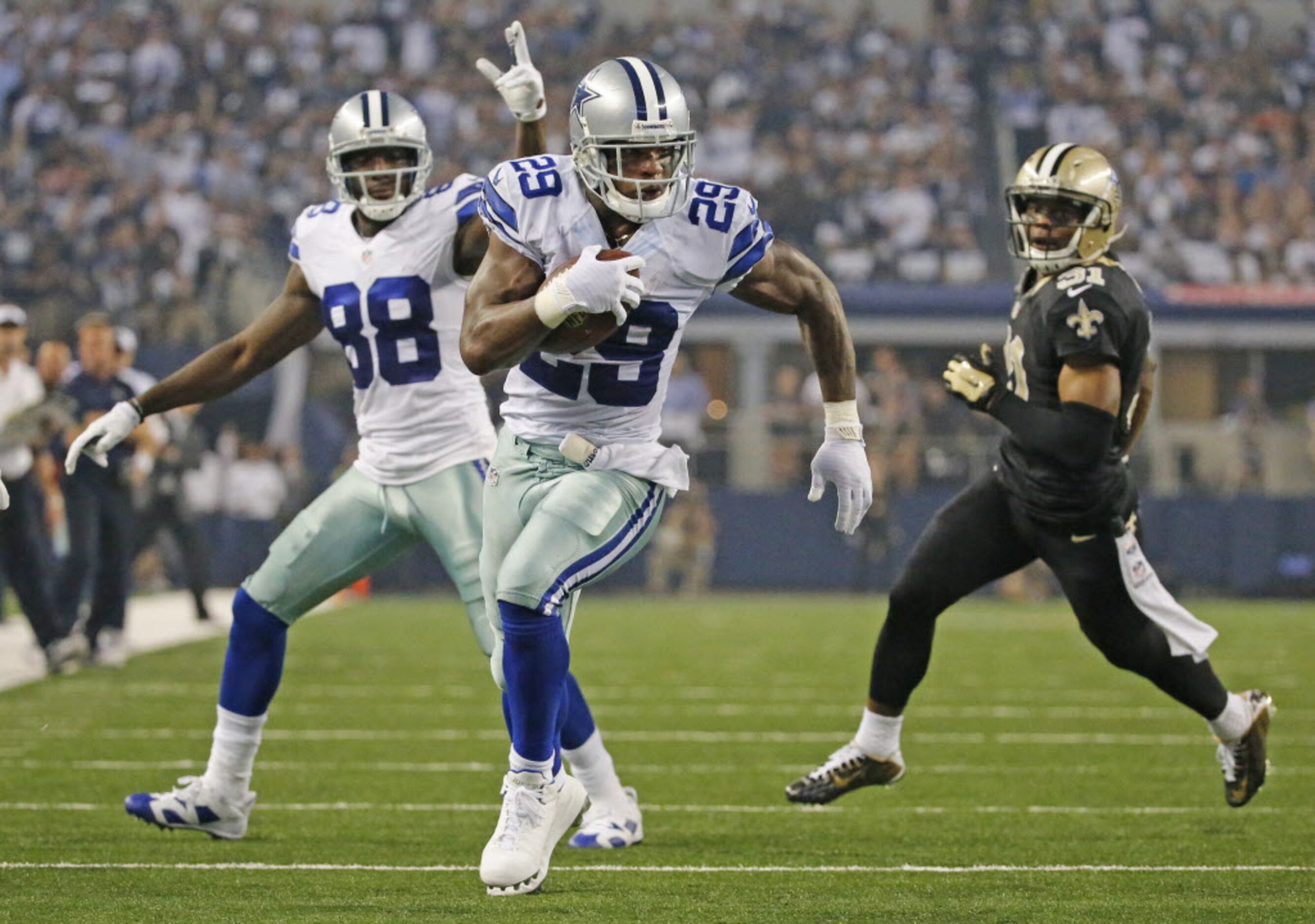 Dallas Cowboys wide receiver Dez Bryant (88) waves  running back DeMarco Murray (29) to the...