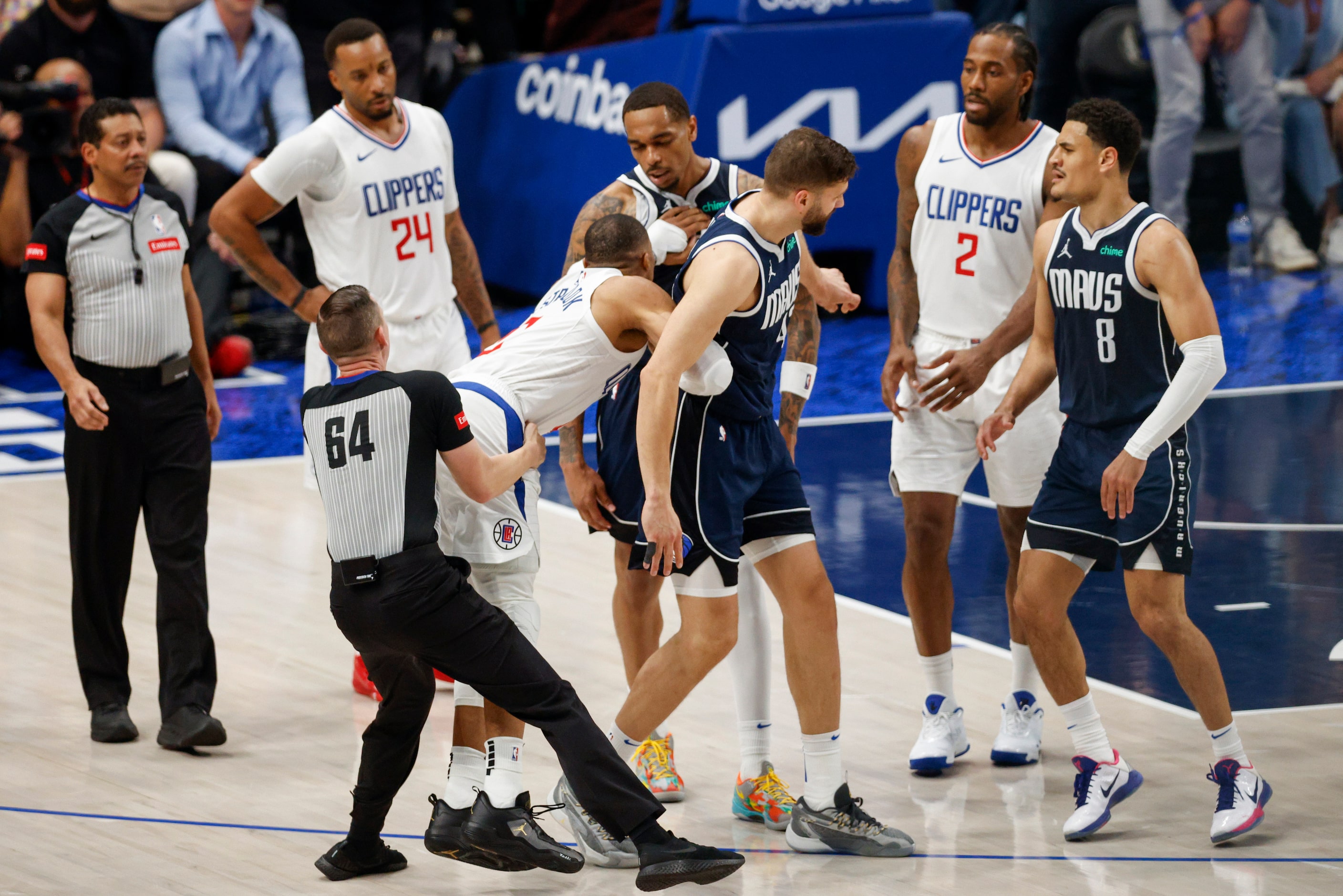 LA Clippers guard Russell Westbrook (0) lunges at Dallas Mavericks forward P.J. Washington...