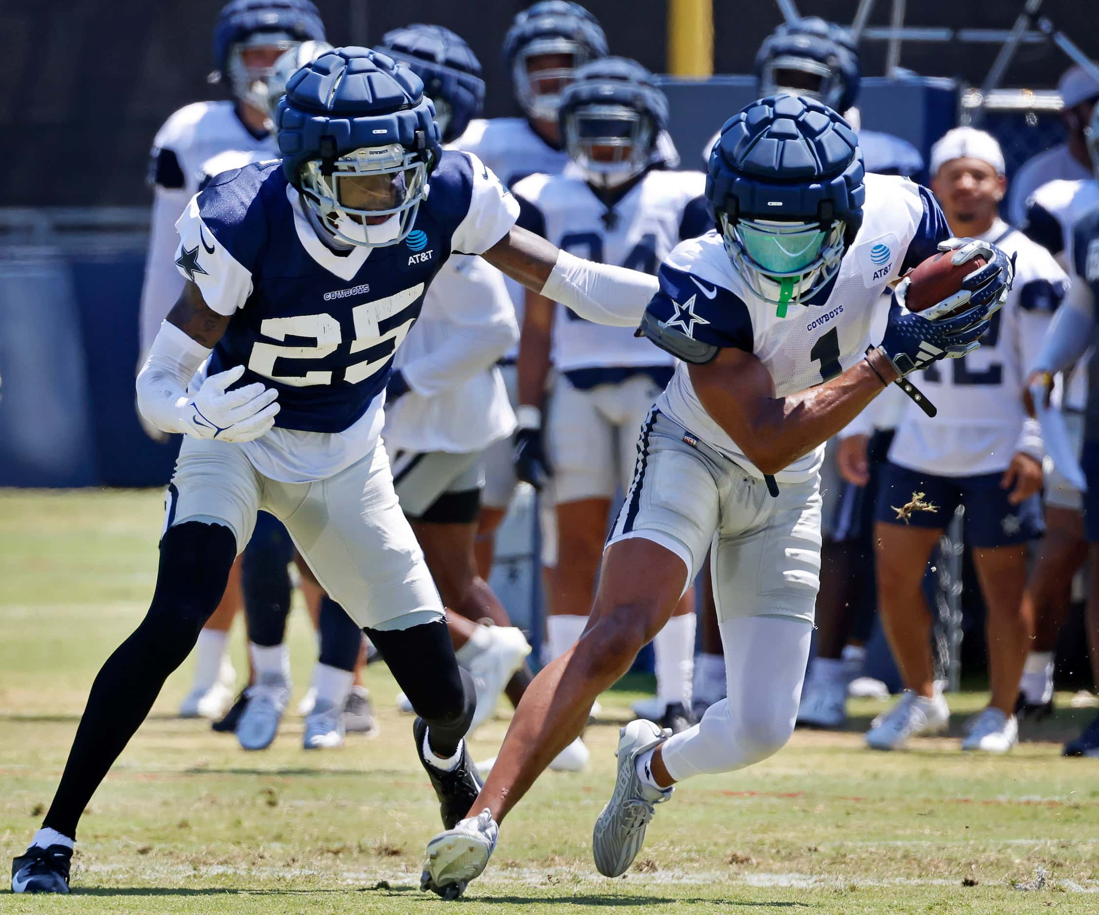 Dallas Cowboys wide receiver Jalen Tolbert (1) pulls in a pass as he’s covered by cornerback...