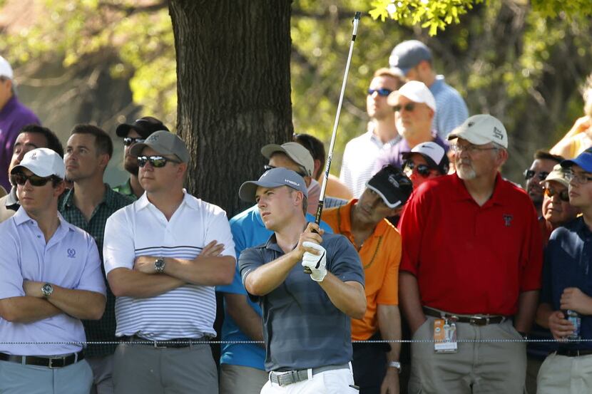 Golfer Jordan Spieth hits a shot from the rough on No. 14 during the third round of the Dean...