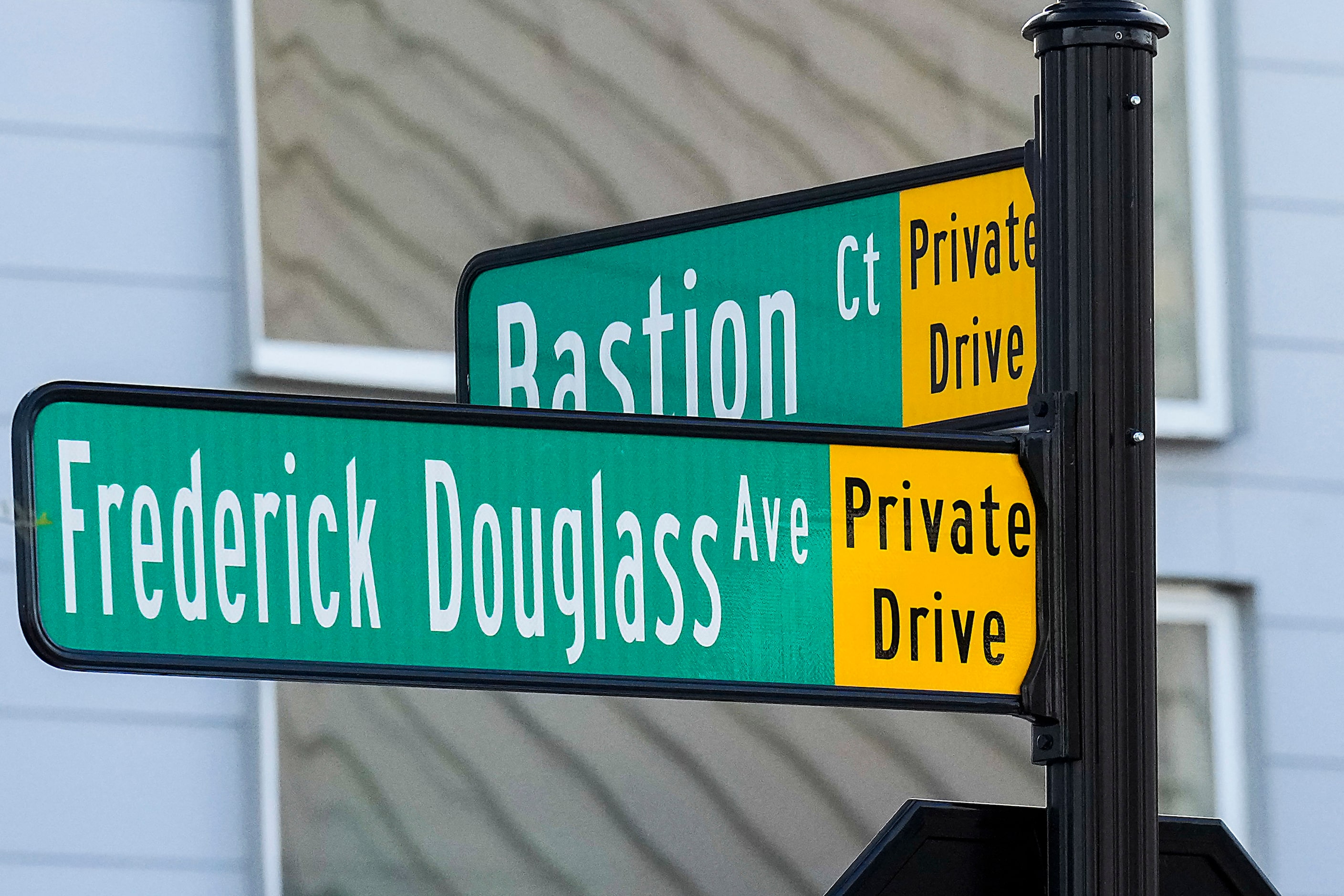 Signs mark the intersection of Frederick Douglass Avenue and Bastion Court in the...