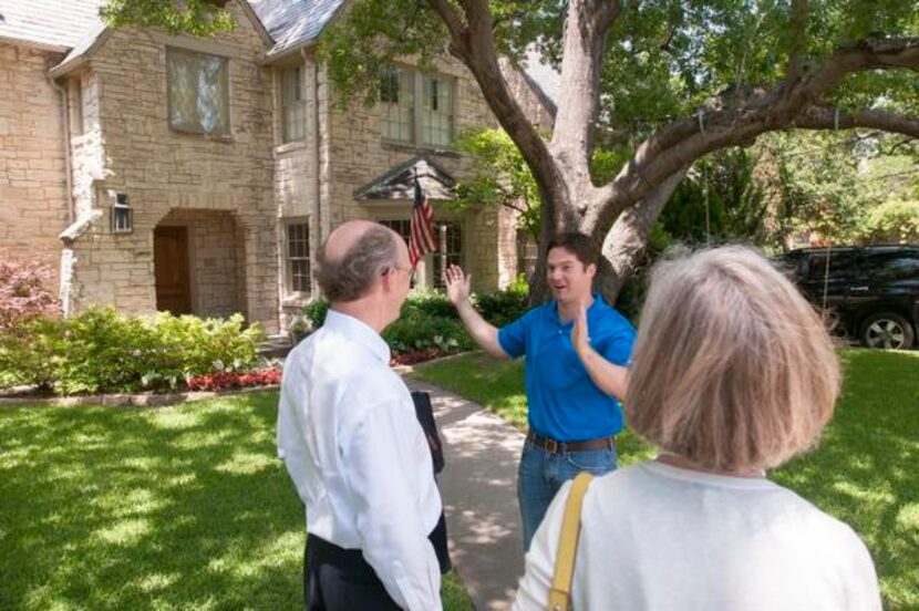 
Republican Chart Westcott (center) campaigned near his Snider Plaza headquarters, talking...