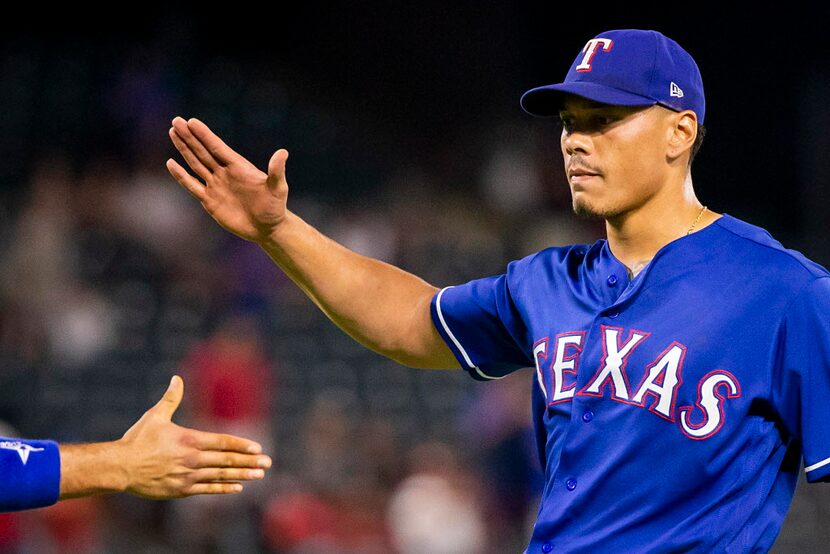 Texas Rangers relief pitcher Keone Kela celebrates with catcher Isiah Kiner-Falefa after...