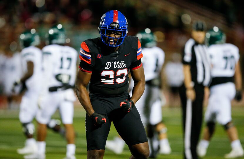 Duncanville senior defensive lineman Omari Abor (23) celebrates a Waxahachie fumble and...