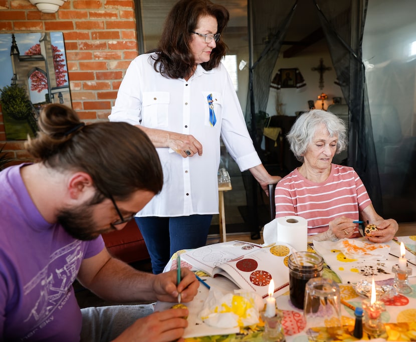 Chystya Geremesz watches Janet Sparks draw on an egg using a kistka, Saturday, April, 2,...