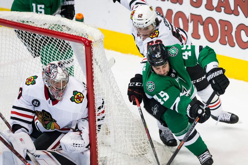 The Stars' Roman Polak (45) comes around the corner with a shot at the goal blocked by...