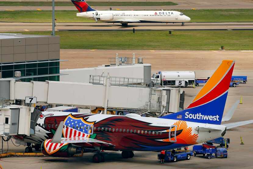 
A Delta commuter jet landed in April at Dallas Love Field as a Southwest Airlines was...