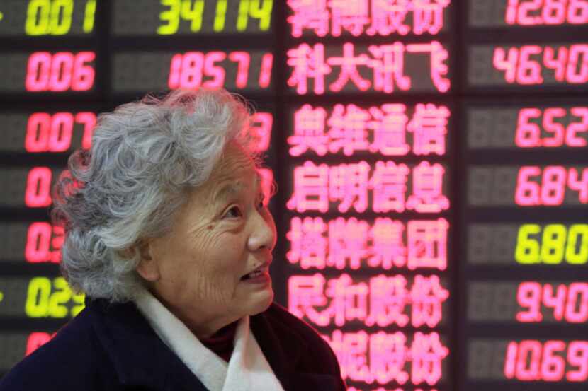 An investor checks stock prices in Shanghai, China. Over the last two years, stock prices of...