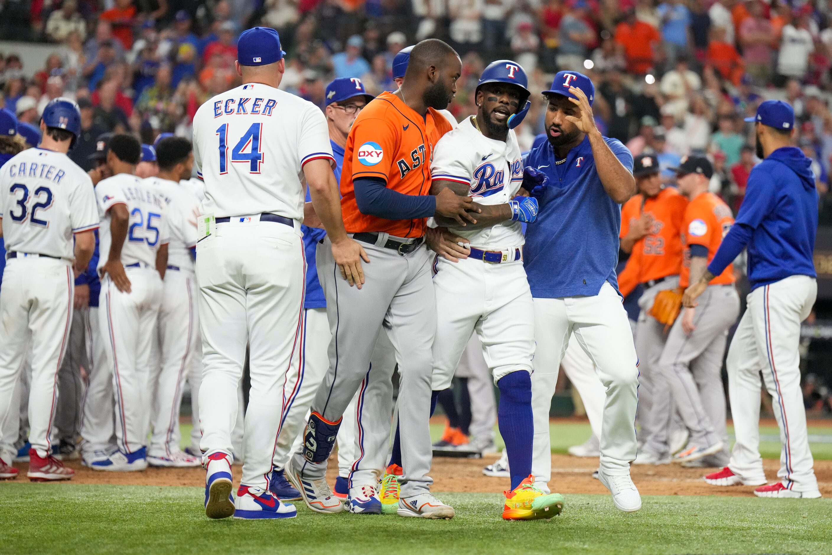 Houston Astros designated hitter Yordan Alvarez (44) and Texas Rangers infielder Ezequiel...