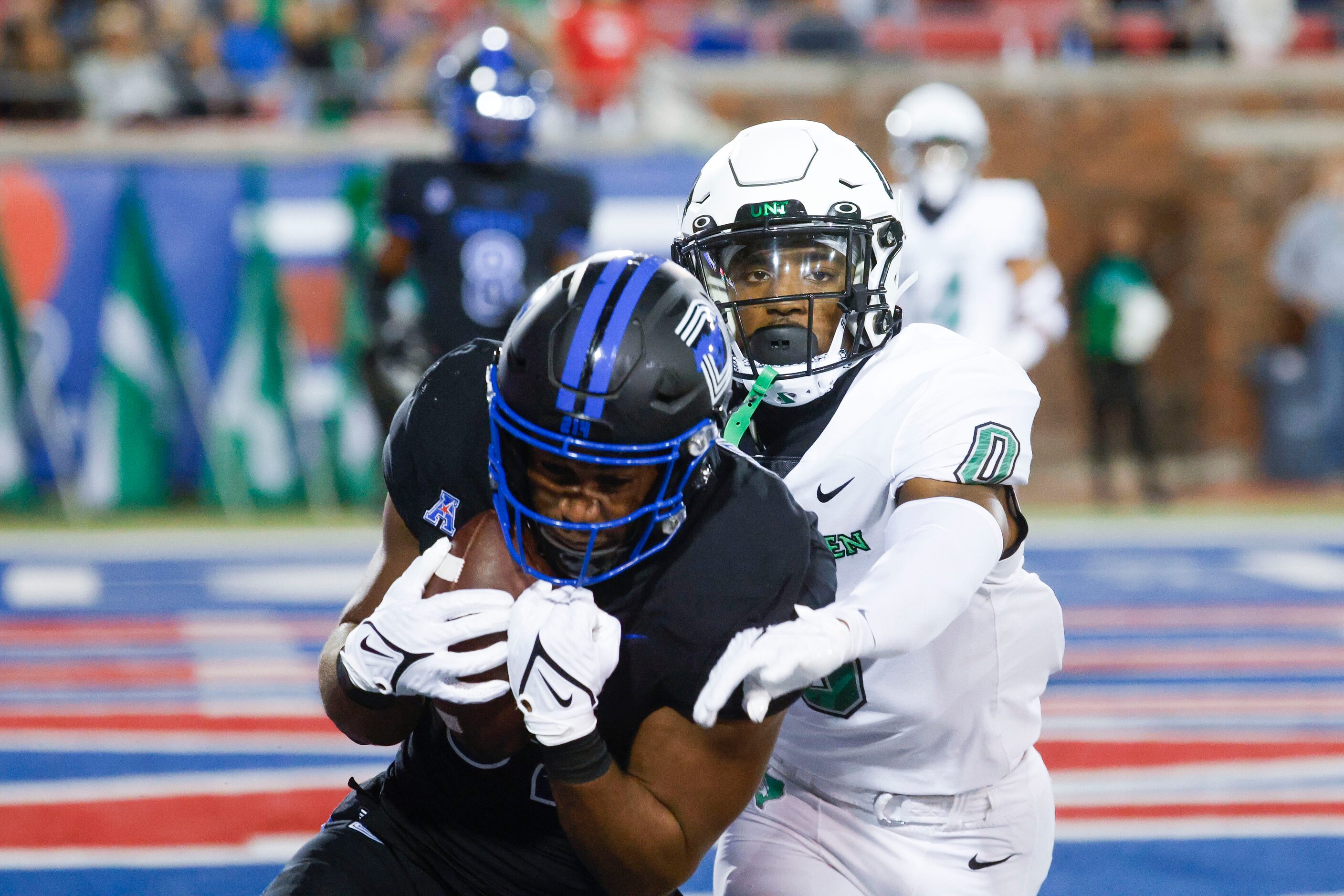 Southern Methodist Mustangs wide receiver Joey Bruszer (left) scores a touchdown past North...