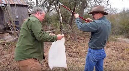 Tedrick stuffs the snake into a pillowcase so it can be transported to a safe distance away...