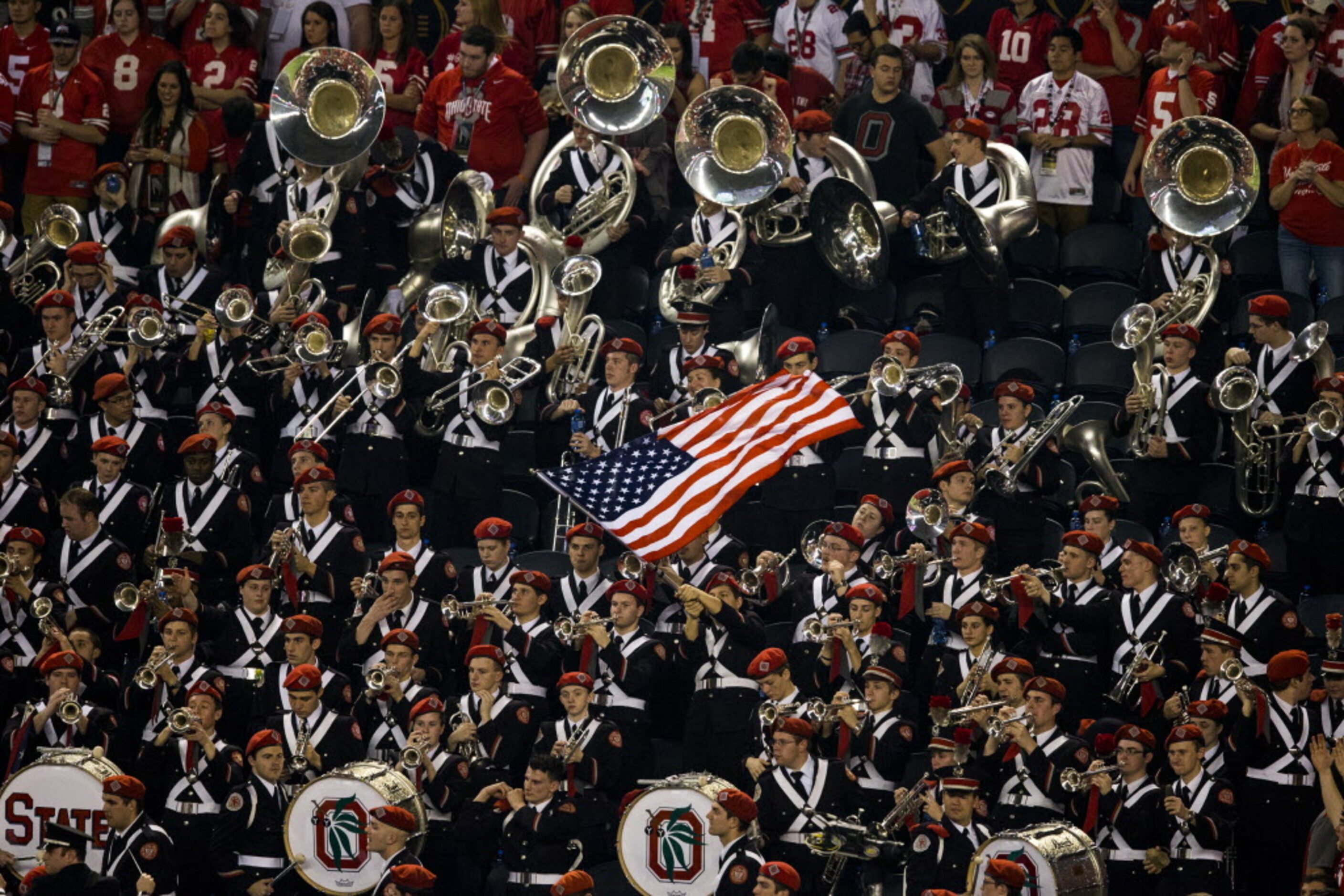 Members of the Ohio State Buckeyes band wave the Stars and Stripes during the third quarter...