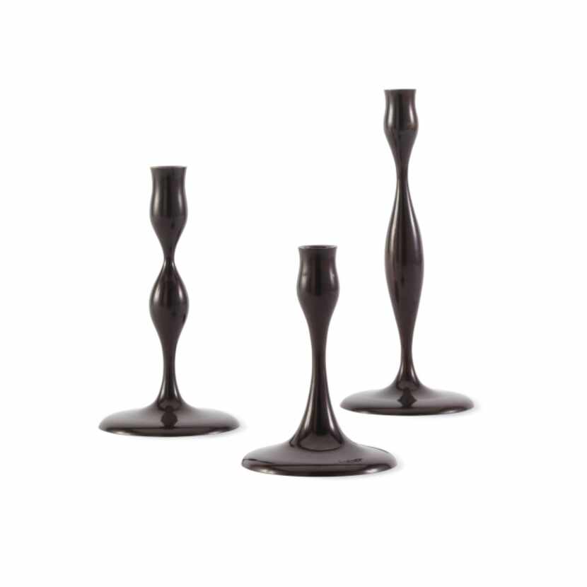A curvy bronze trio designed by the late Eva Zeisel and made by the sand-casting method...
