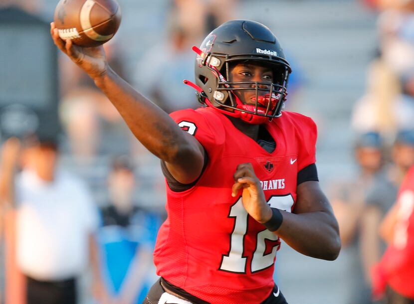 Frisco Liberty High School quarterback Keldric Luster (12) throws a pass during the first...