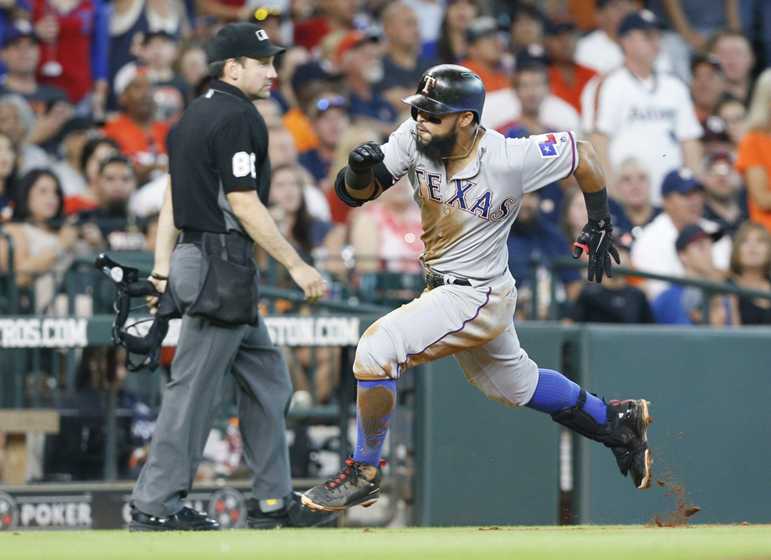 HOUSTON, TX - JULY 28:  Rougned Odor #12 of the Texas Rangers rounds third base after...