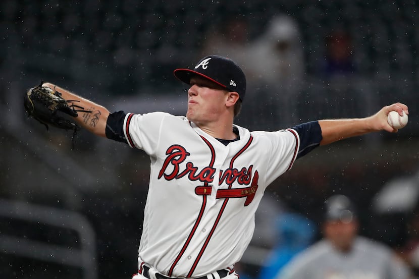 Atlanta Braves starting pitcher Kolby Allard works in the first inning of a baseball game...