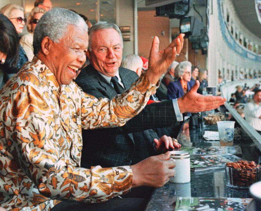 Nelson Mandela reacts to a play during the Dallas Cowboys-Washington Redskins game in...