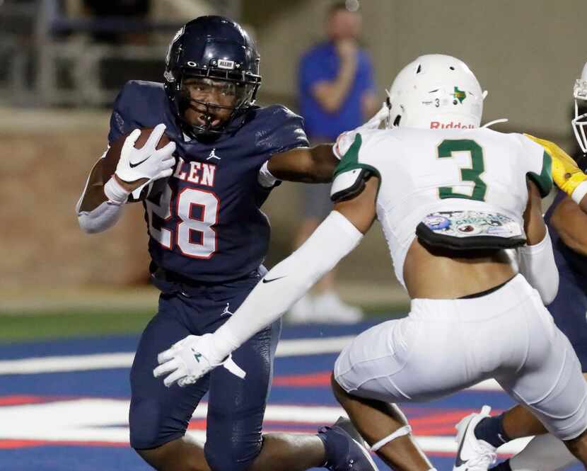 Allen High School running back Amir McDowell (28) escaped this tackle attempt by DeSoto High...