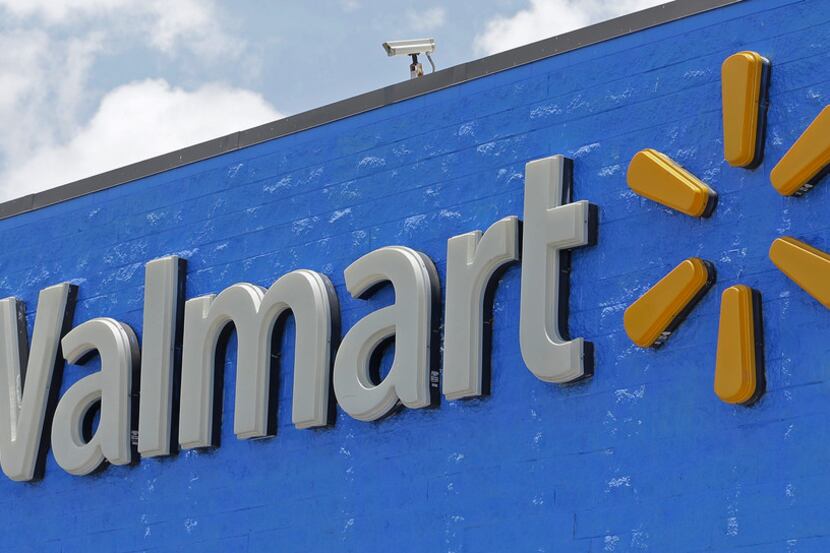 FILE - This Thursday, June 1, 2017, file photo, shows a Walmart sign at one of the...